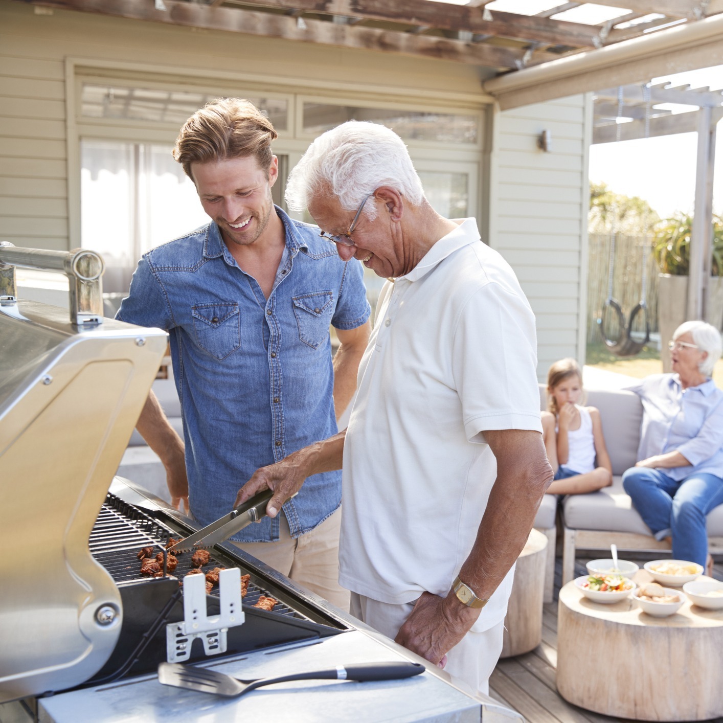 Gen X Sandwich Generation Financial Planning conversation while grilling