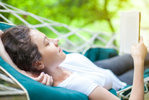 Woman reading in a hammock; ongoing coordination with insurance and attorneys.