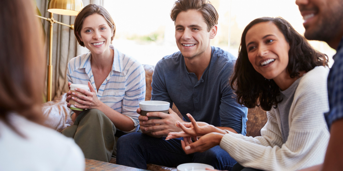 friends having coffee together feeling confident this tax season that they have planned their investing with tax planning