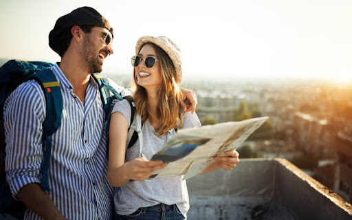 Young couple traveling with a map in the city. Choosing the right investment strategy provides peace of mind.
