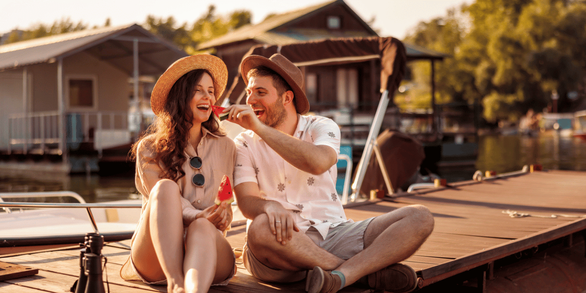 couple at lake house whos smart money saving habits allowed them to make this purchase and